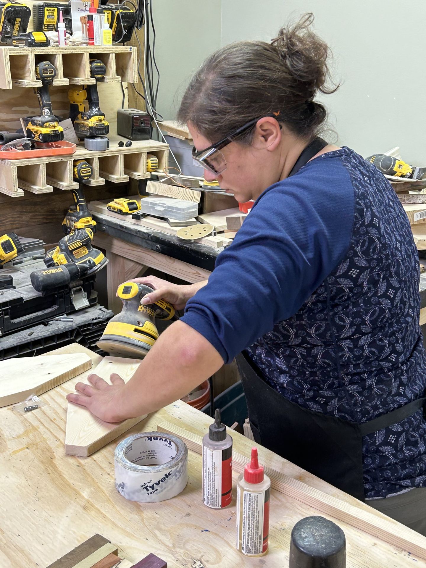 Hands-on sanding of a woodworking project at ILW